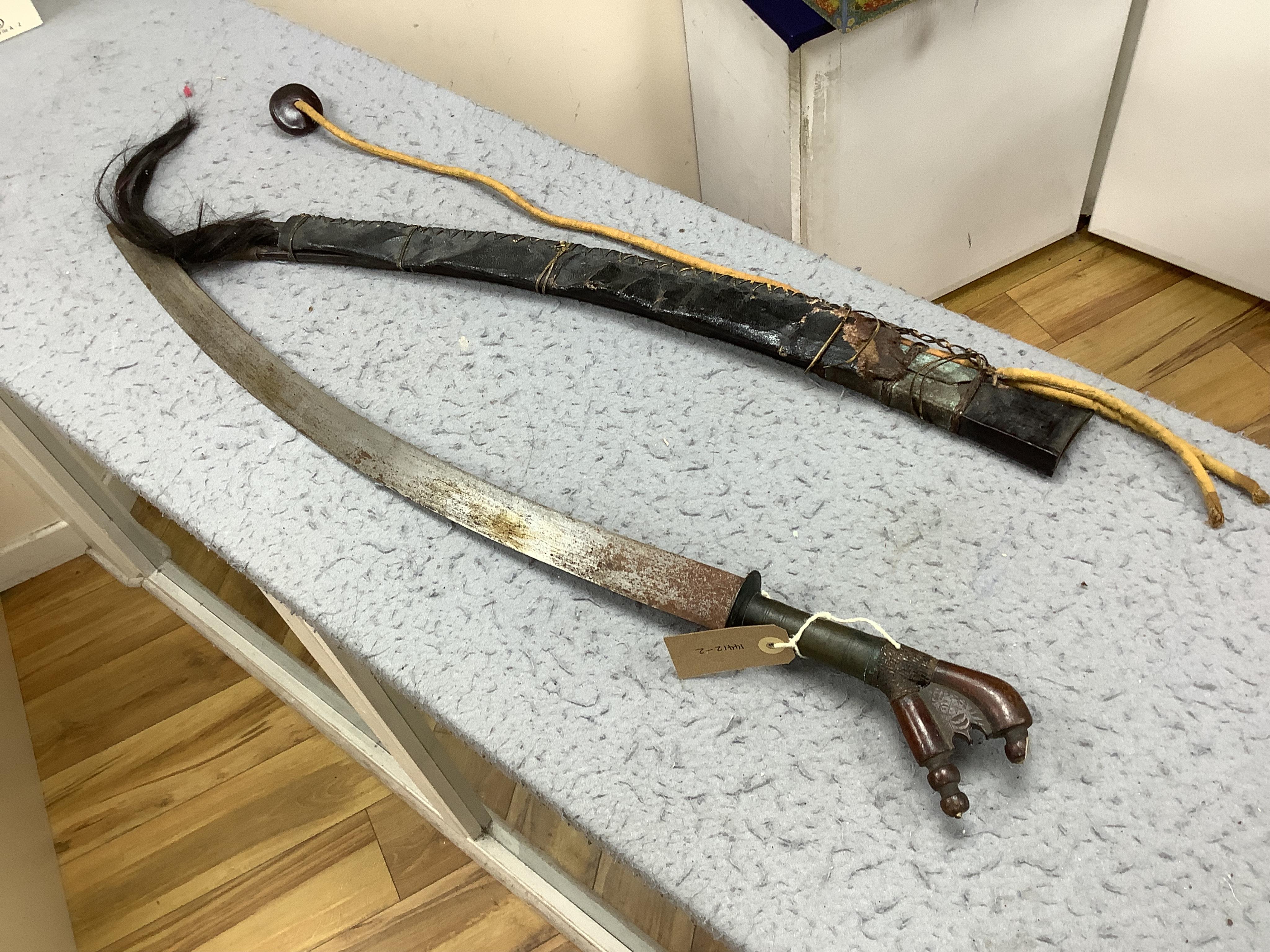 A group of assorted bladed weapons including a kukri, a jambiya, etc, longest 84cm